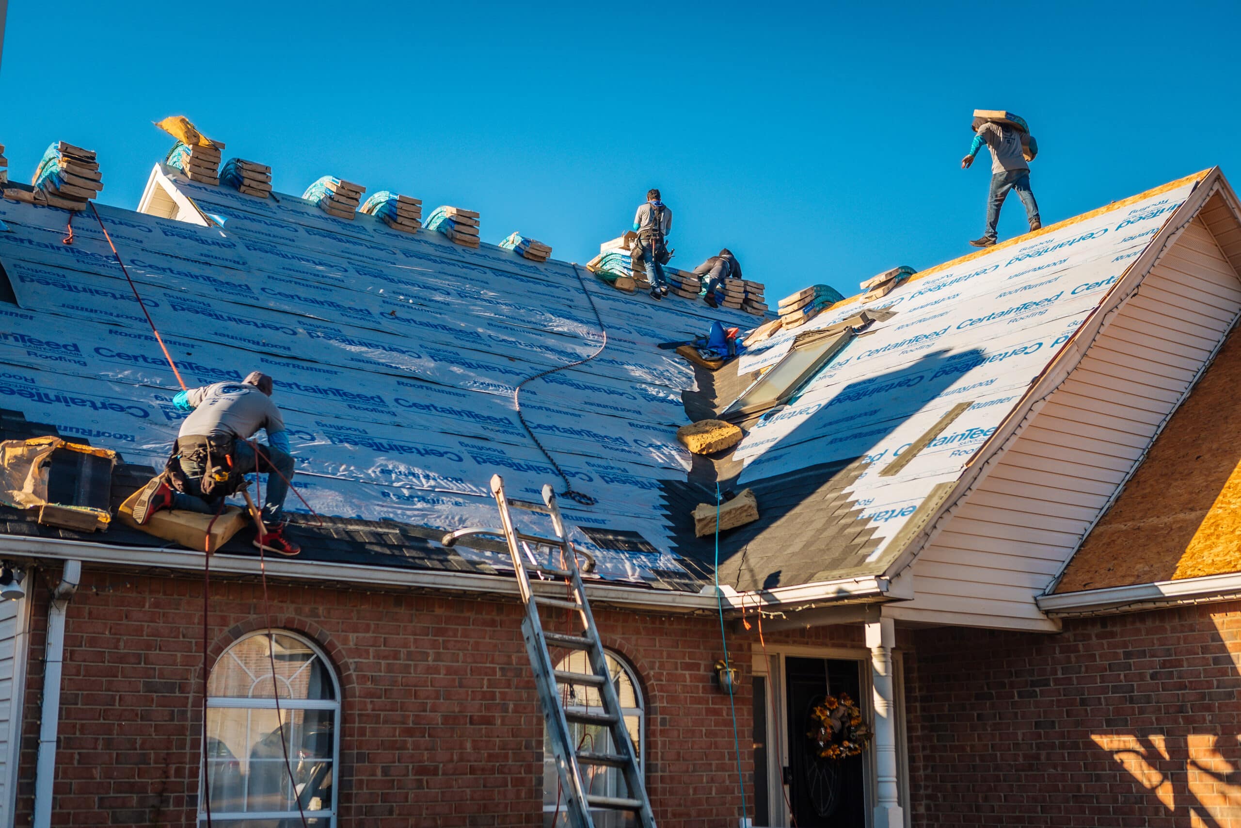 Roof Repair in Nashville, TN 3 Nashville Roofing Company crew installing a new roof on a residential job site