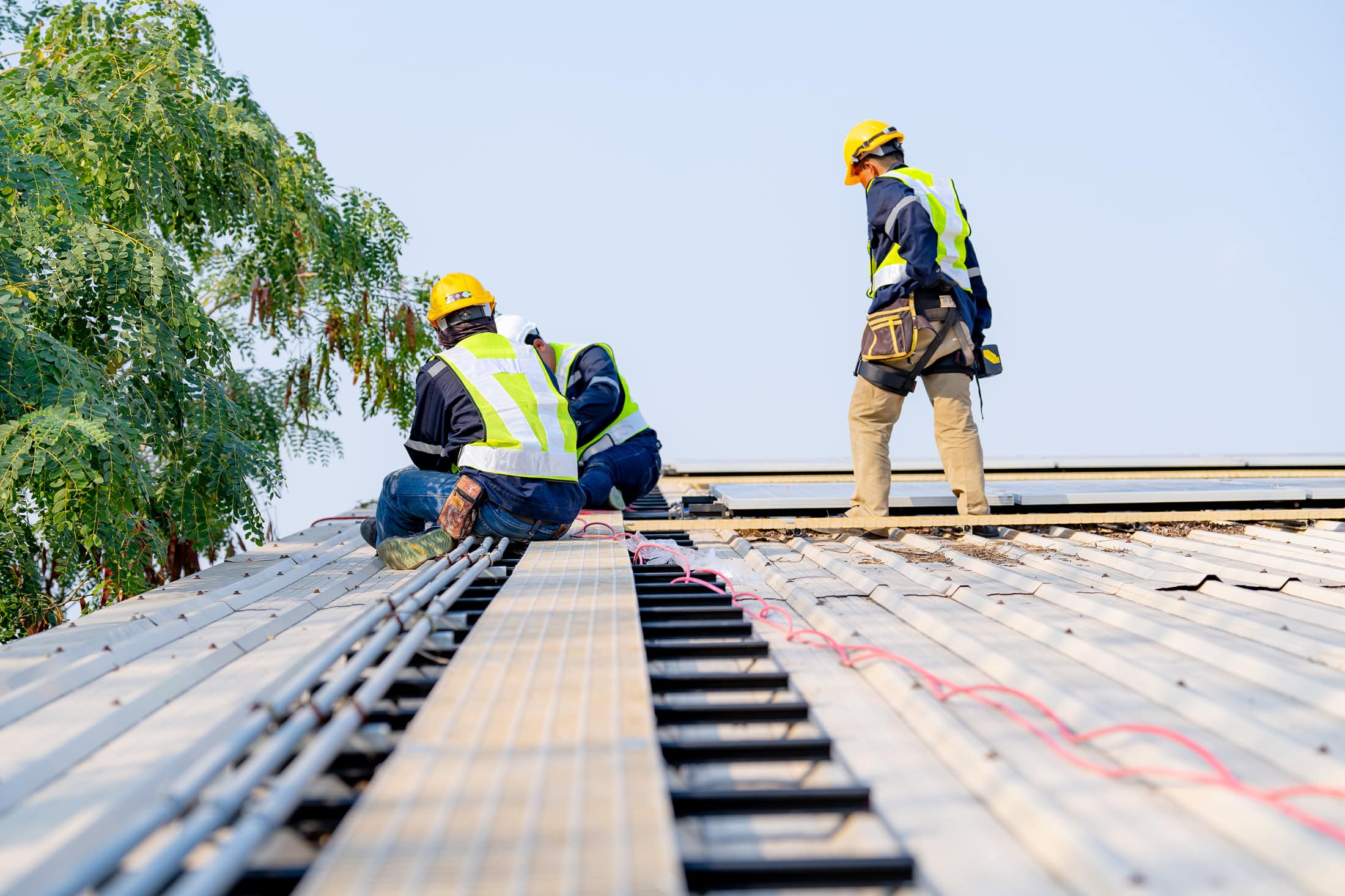 Roof Repair in Nashville, TN 1 Nashville Roofing Company roofers inspecting and repairing a roof in Middle Tennessee