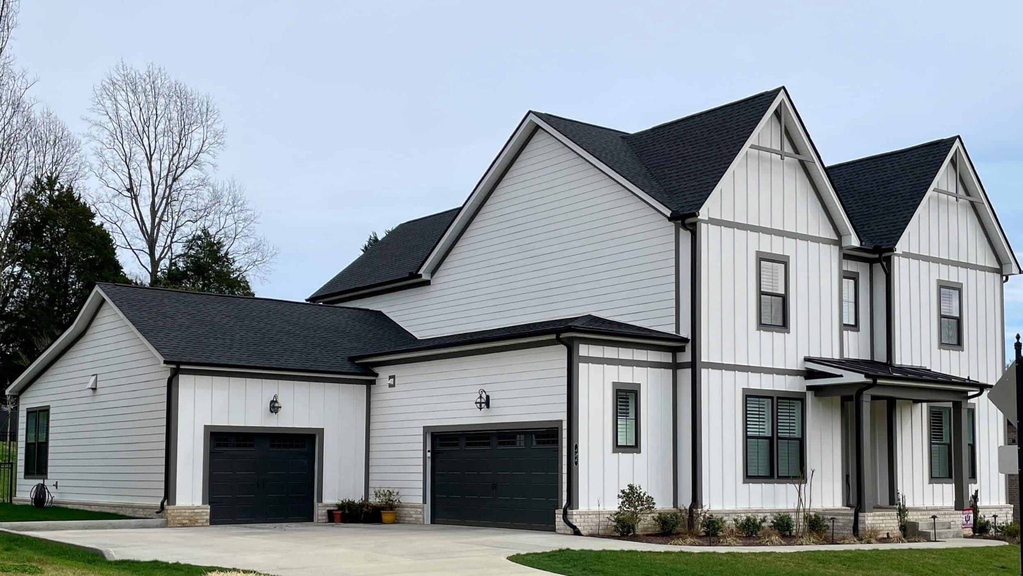 Home 8 Completed white home with dark asphalt shingle roofing and contrasting exterior siding.