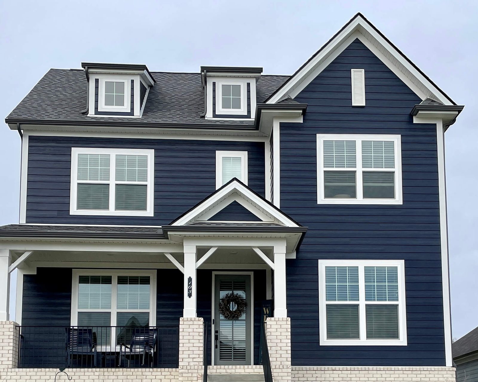 James Hardie Siding in Nashville, TN 2 Navy James Hardie siding with white trim on a two-story Nashville area home